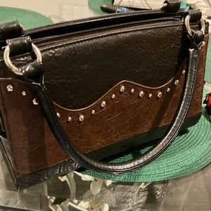 Beautiful purse. Name brand as pictured. Very very good shape